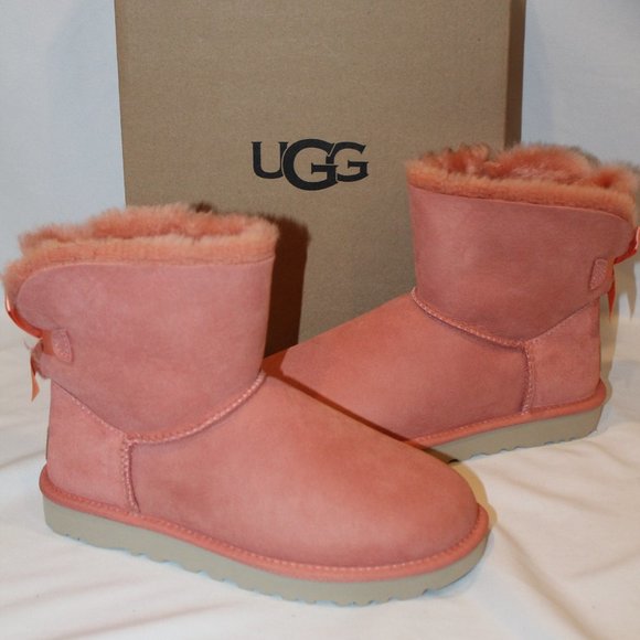 NIB UGG WOMEN'S MINI BAILEY‎ BOW SUEDE SHEARLING LINED ANKLE BOOTS CORAL - Picture 1 of 9
